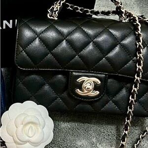 Chanel Black Lambskin Mini w/light Gold Chain/ Mint condition